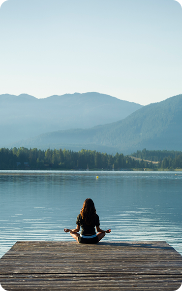 A woman doing yoga on a pontoon